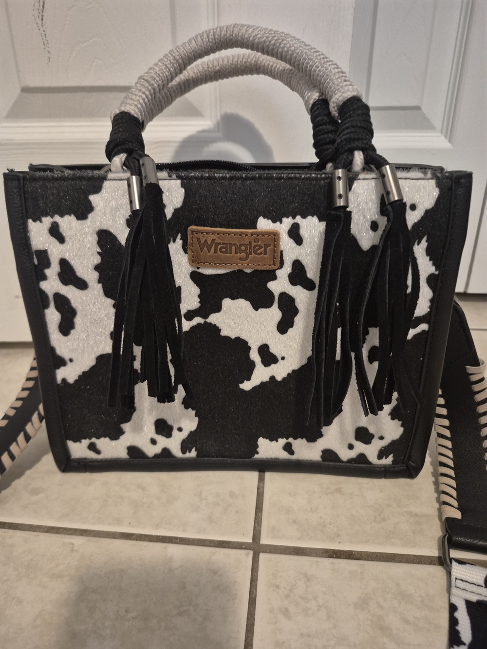 NWOT Wrangler Black and White Cow Print Satchel with Tassels